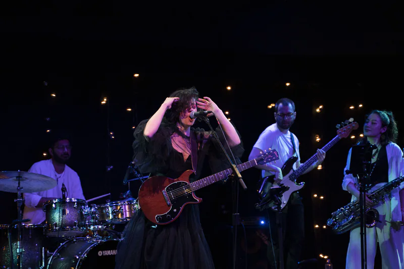 JER on stage with her full band