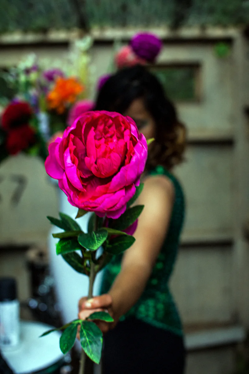 JER holding a large pink peony, by Ksenija Hotic